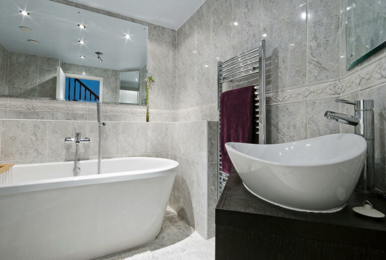 luxury bathroom with bath and sink