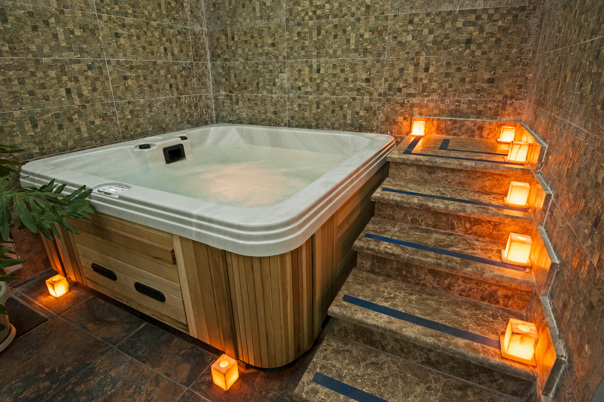 Large jacuzzi with wooden side and stairs