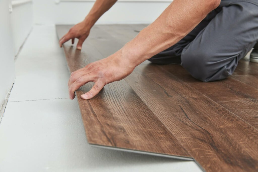 Man installing a a flooring