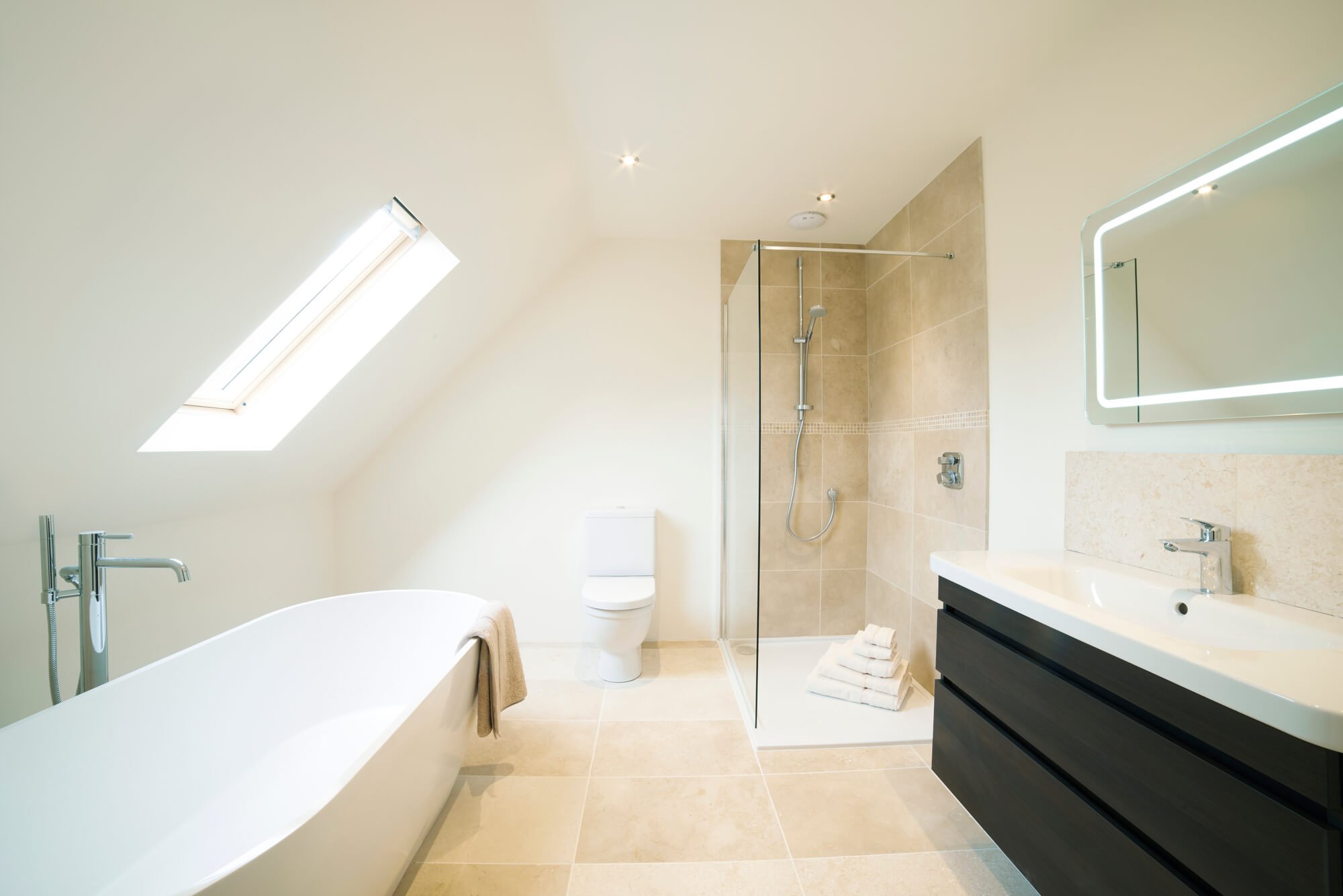 Bright large bathroom with Velux window installed