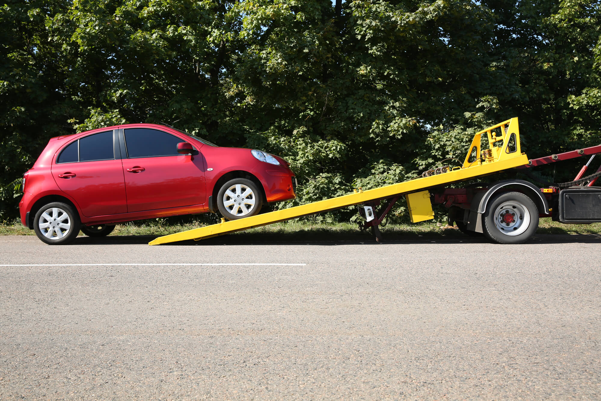 red car loading on a truck trailer