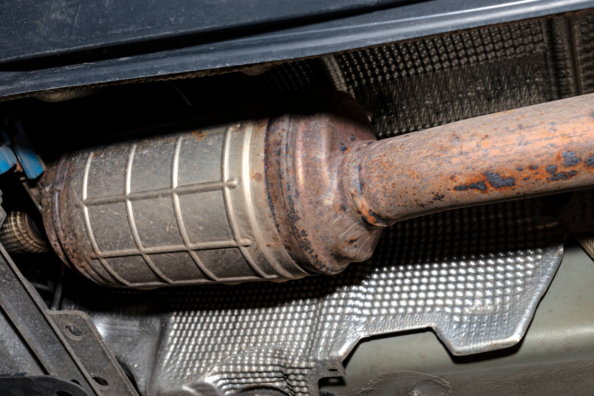 close up view to DPF under a car